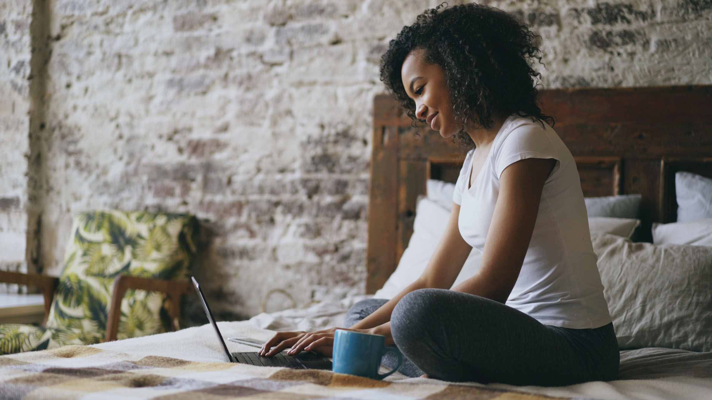 Woman at home using e-learning platform on the computer